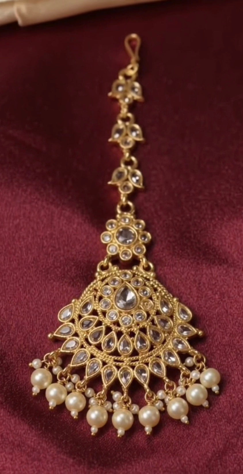 traditional gold-finished kundan maang tikka with pearl drops