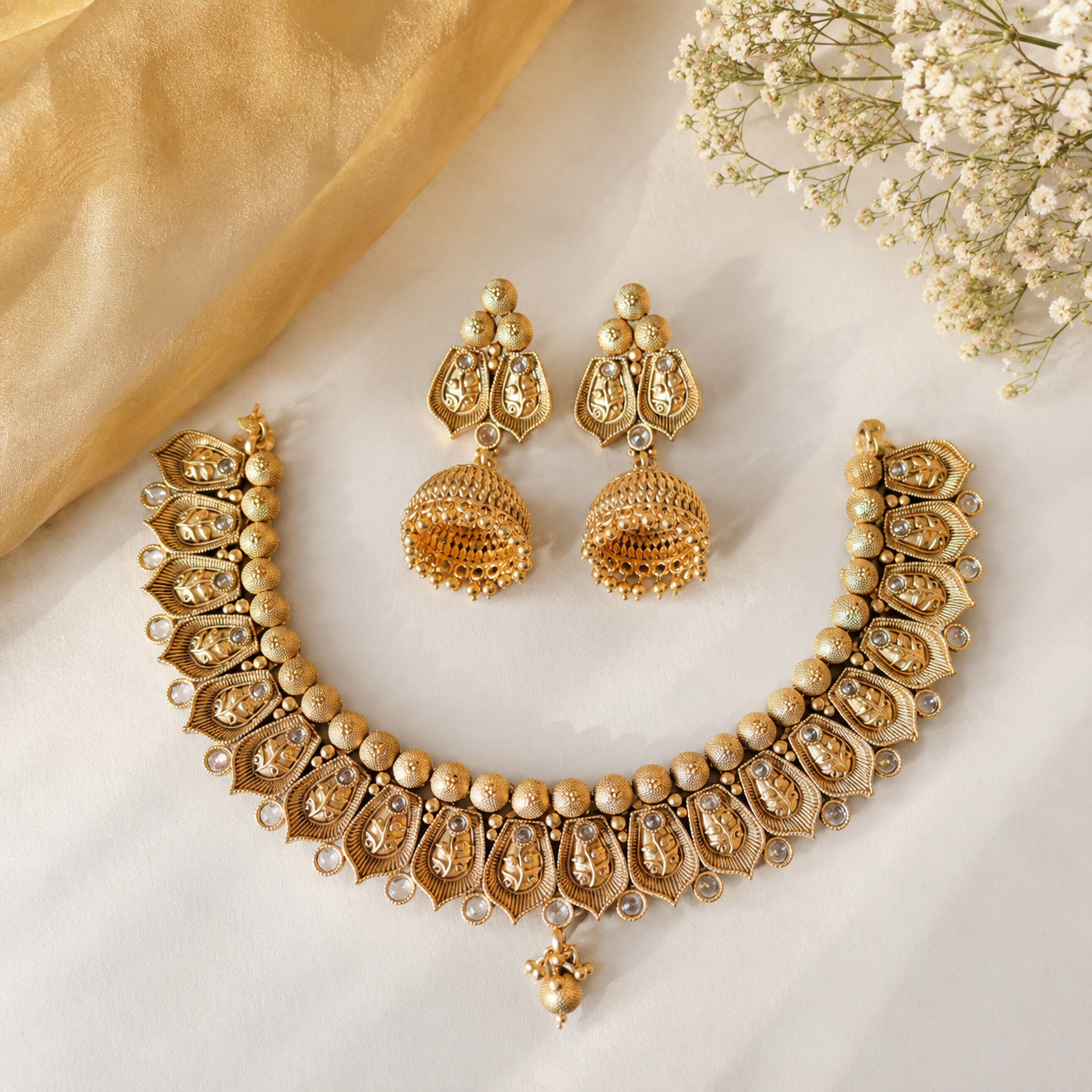 royal heritage temple choker set with antique gold jhumkas